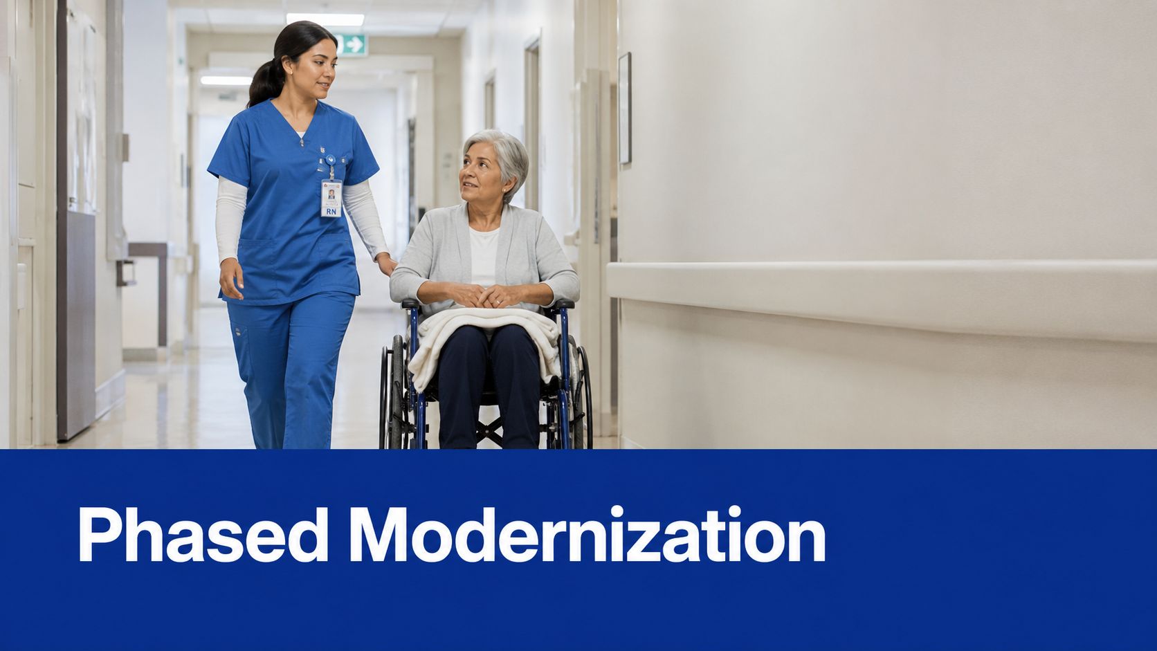 A registered nurse pushing an elderly patient in a wheelchair down a modern hospital corridor.